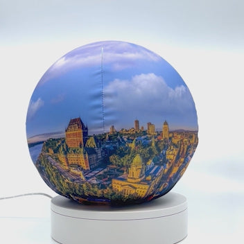 360°-rotating fabric sphere cover featuring Quebec City at sunrise, wrapped around a 8.7" soccer ball, 9.5" basketball ball, or a 10" globe.
