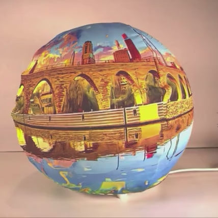 Video of hands wrapping a fabric sleeve onto a light globe